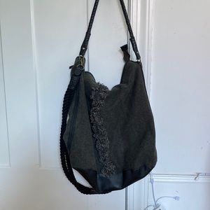 Black tassel free people crossbody bag removable strap inner pockets